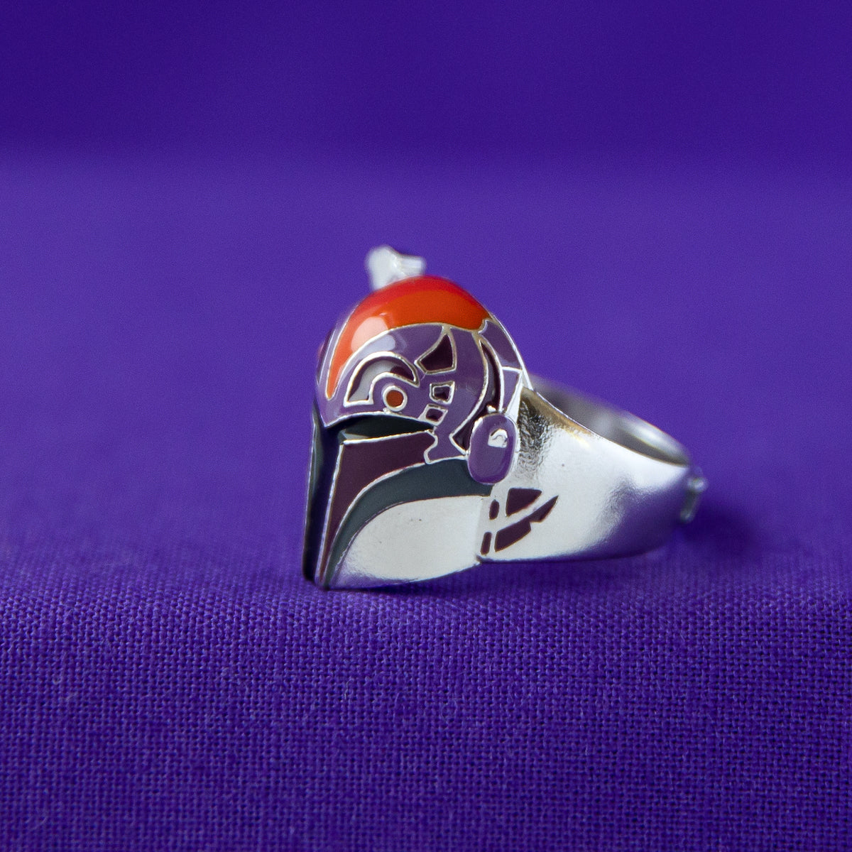 View of the ring band featuring the word REBEL sculpted in a bold font.