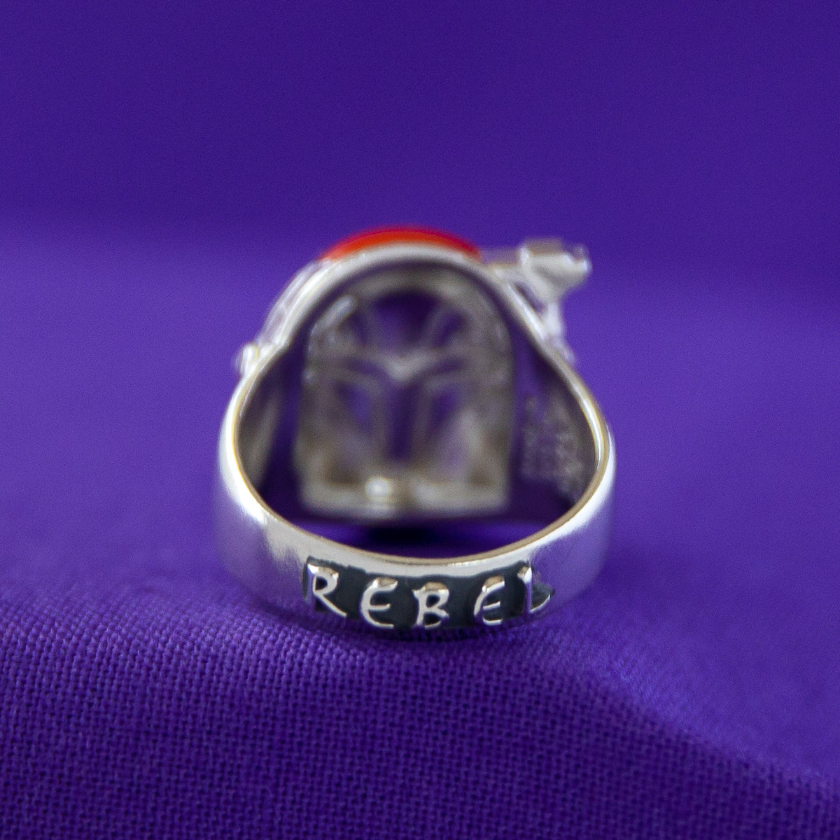 Display of the Sabine Wren ring against a dark background to show metallic contrast.
