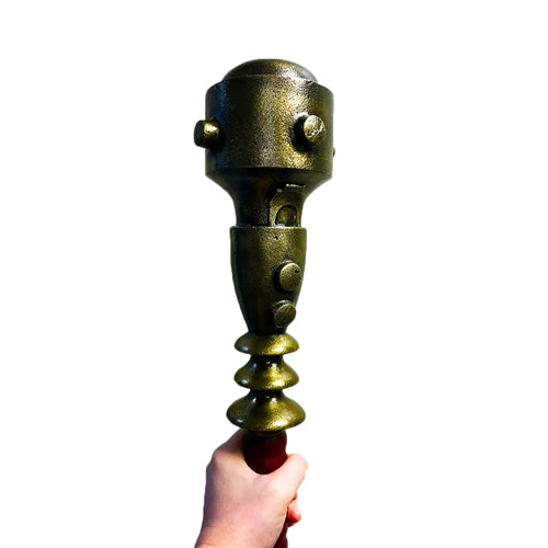 Detailed texture of battle-worn patina on brass mace head