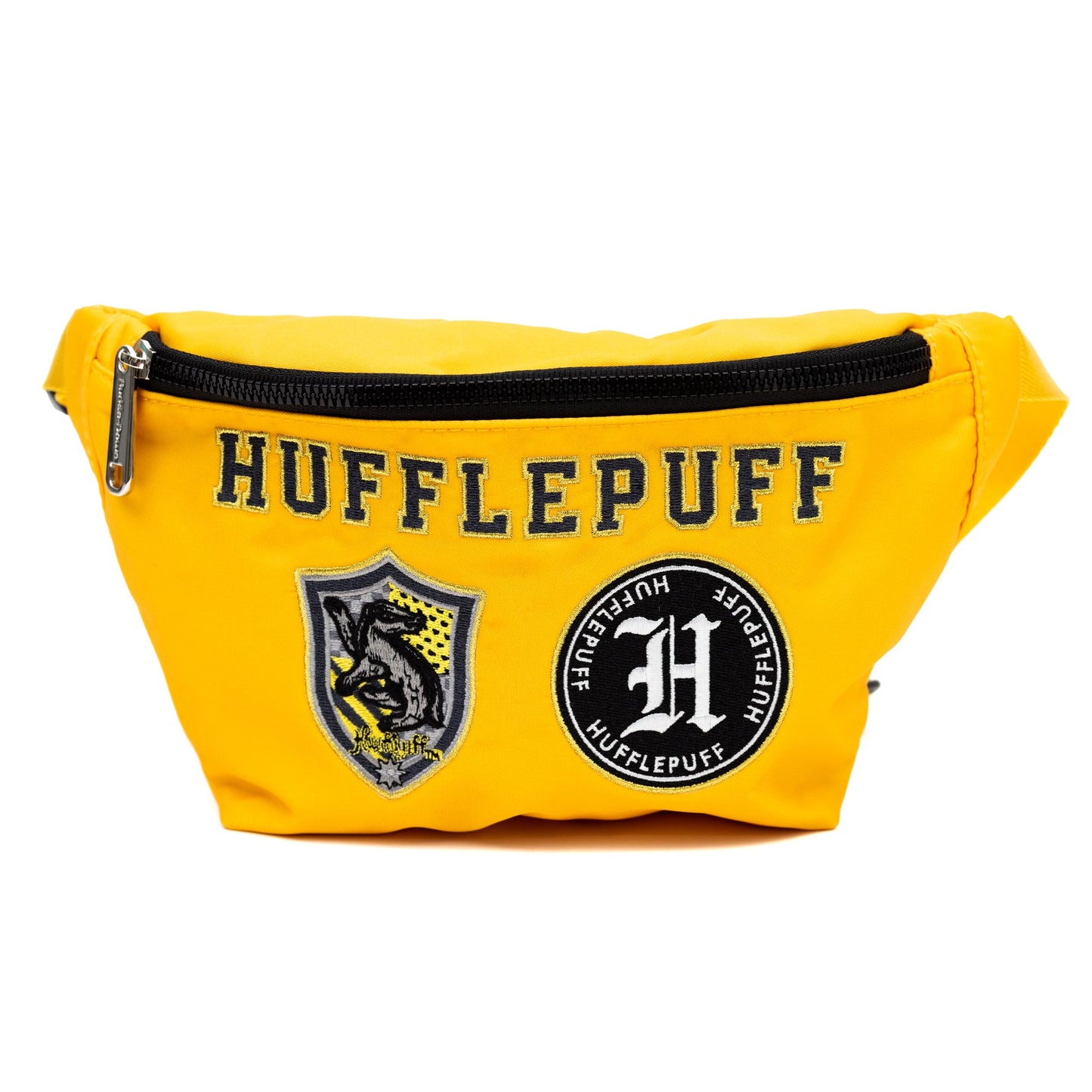 Front view of the yellow Hufflepuff fanny pack showing embroidered patches.