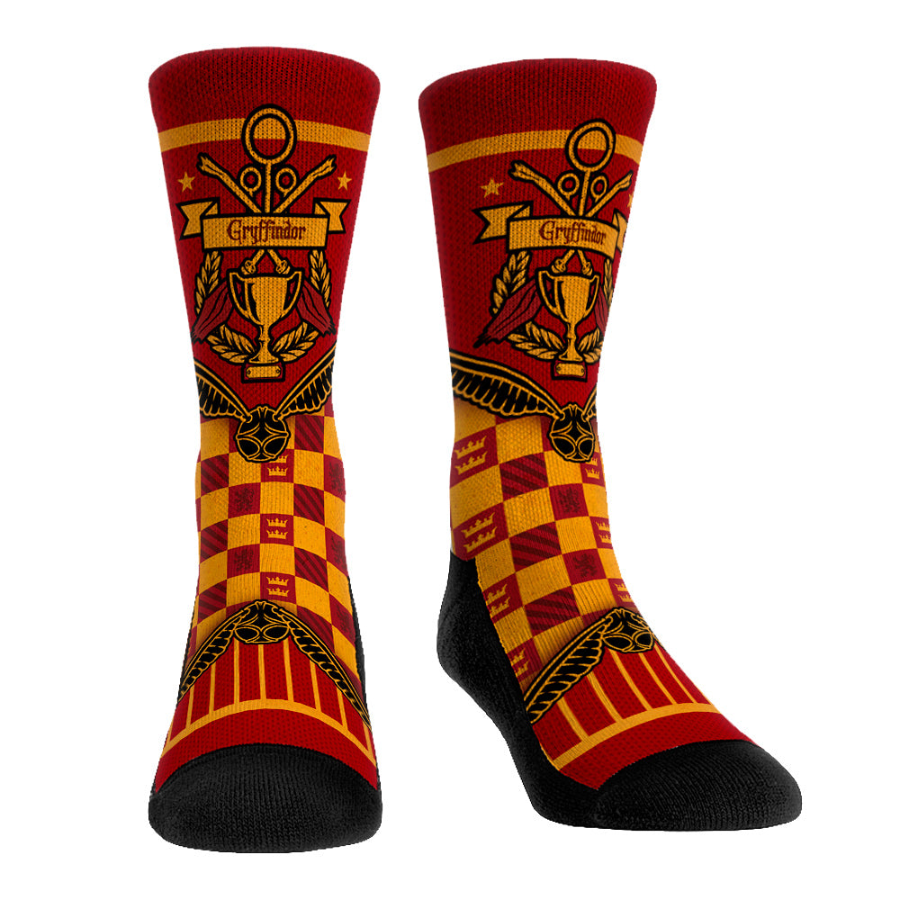 Side view of Harry Potter Gryffindor Quidditch Cup Banner Socks showing the scarlet and gold knit pattern and lion house crest.
