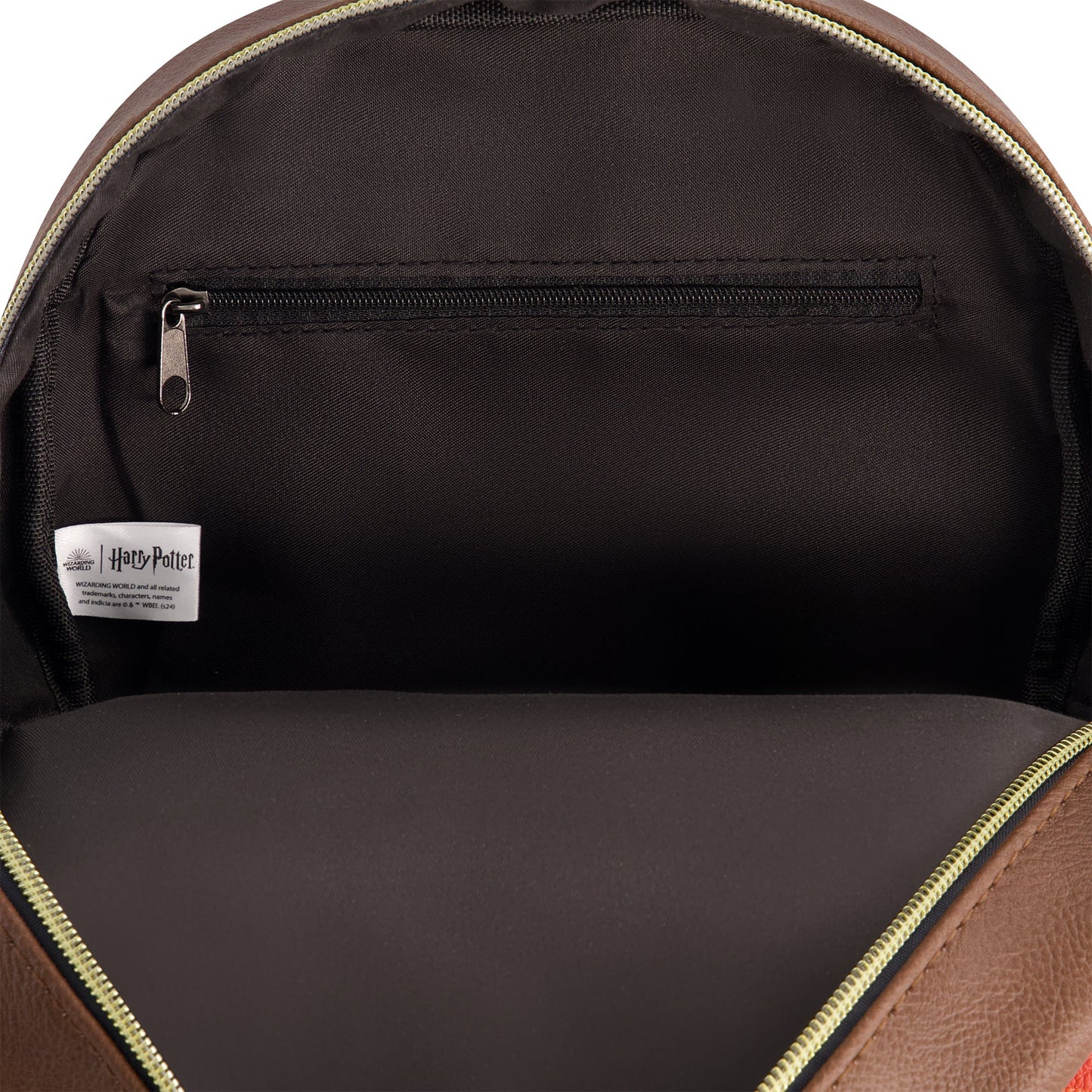 Close-up of the exterior front zip pocket and additional slip pocket for organization.