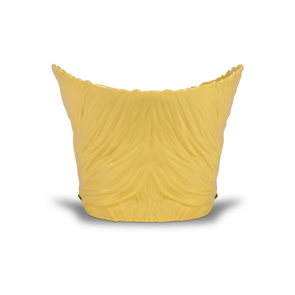 Angled profile view of the plastic Guile Hair popcorn bucket with detailed sculpting
