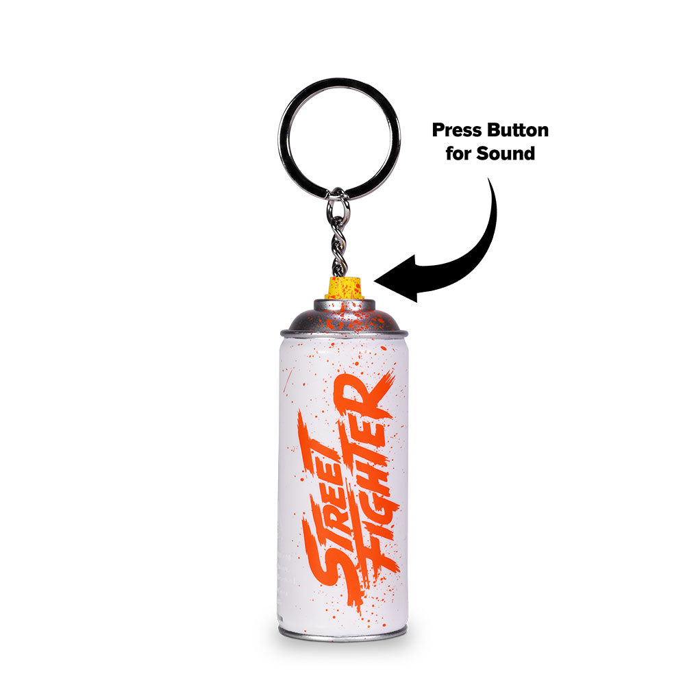 Close-up angle of the Street Fighter collectible keychain highlighting the detailed graffiti-style artwork and branding on the body