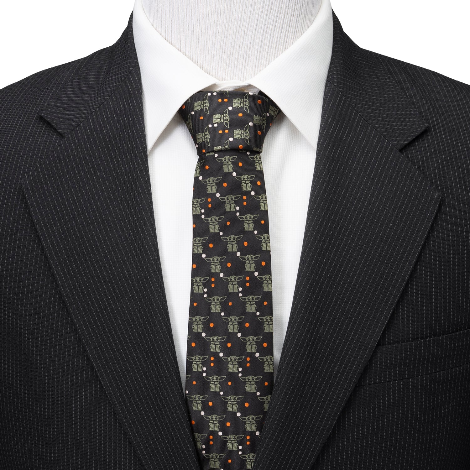 Close up of sage green Grogu motif on black tie
