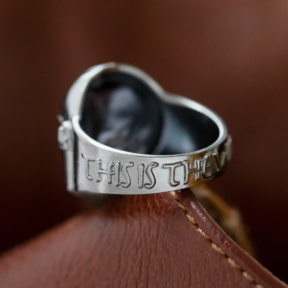 Detail of the hand-painted enamel and polished finish.