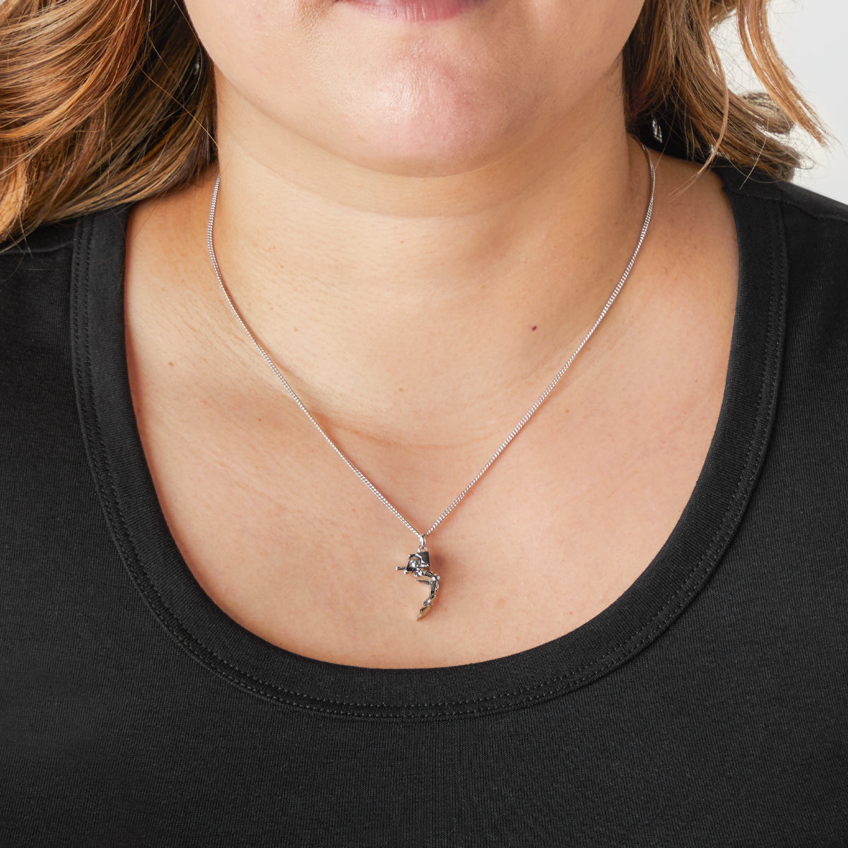 The AT-ST necklace displayed on a model to show size and chain length.