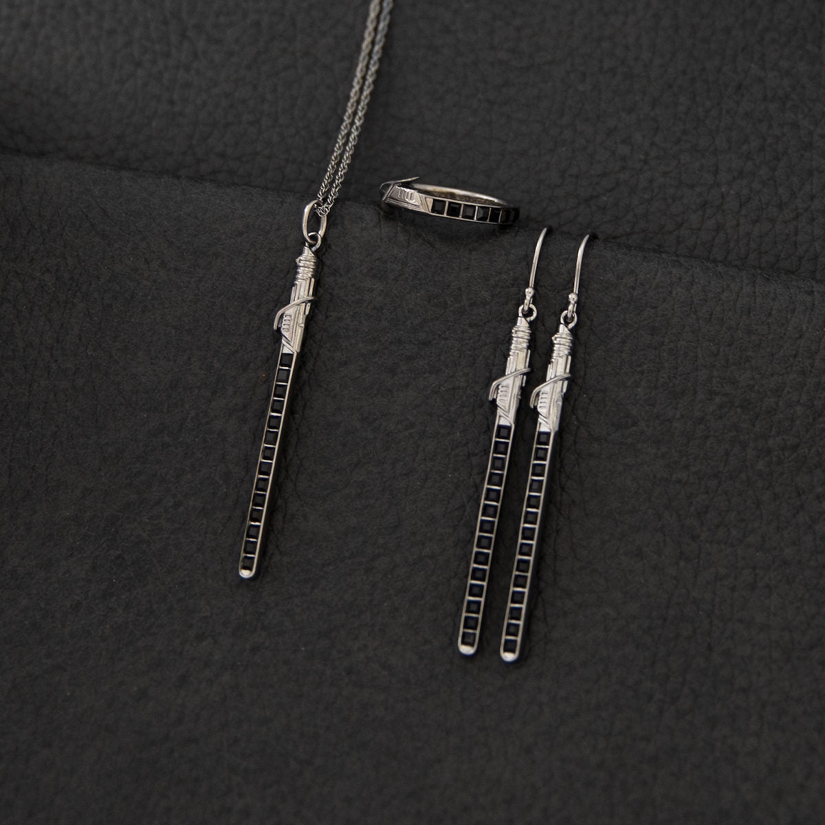 Detail of the adjustable sterling silver chain with the RockLove signature tag and extender weight.